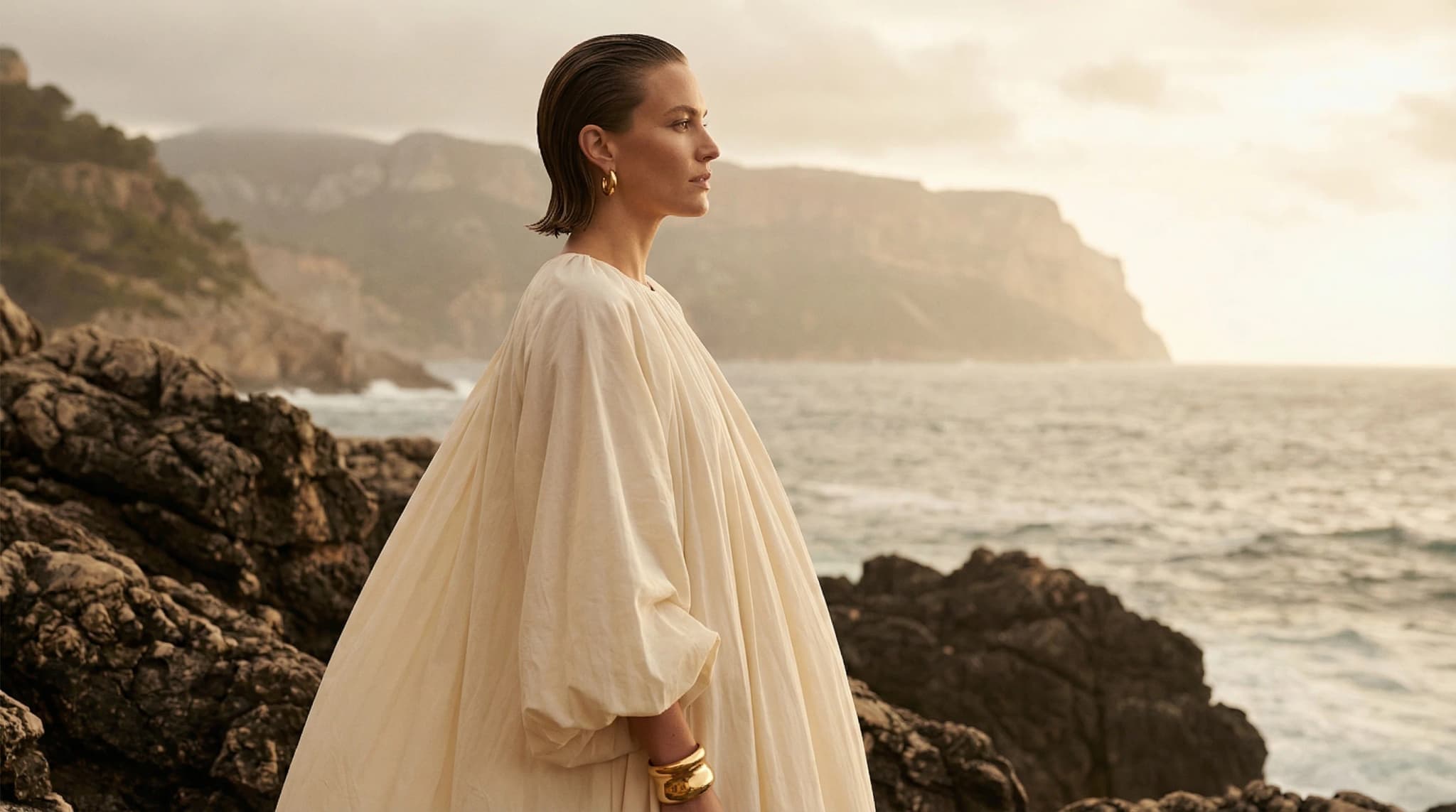 On-location editorial hair and makeup for a coastal photoshoot in Lisbon